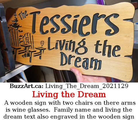 A wooden sign with two chairs on there arms is wine glasses.  Family name and living the dream text also engraved in the wooden sign